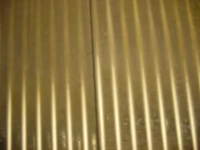 Batterie ailetée traitée, ailettes propres